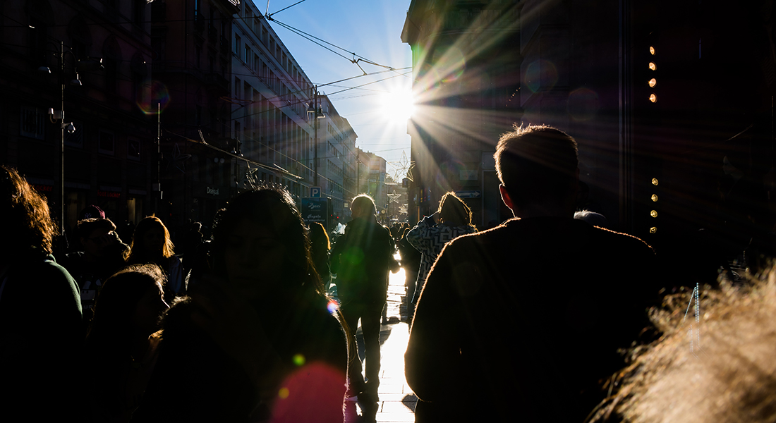 People walking towards the sun